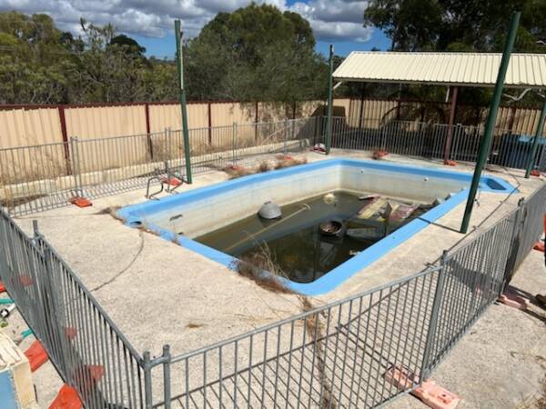 Temporary Pool Fencing in use around a pool no longer in use.