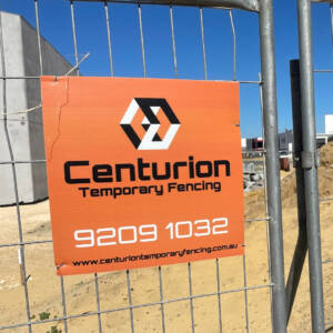 Centurion Temporary Fencing sign on a construction site.